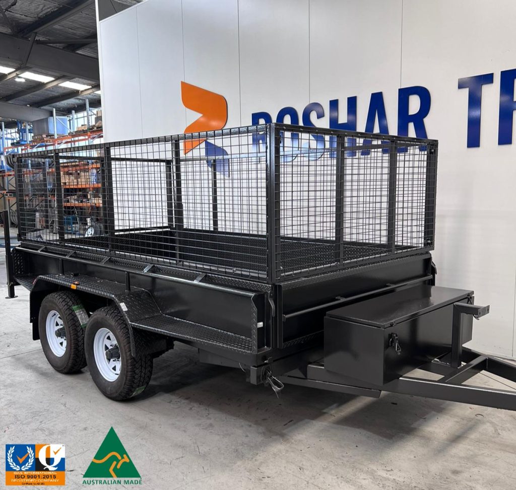 A side view of a 10×5 tandem trailer with a 600mm cage, showcasing the wheels and tow bar